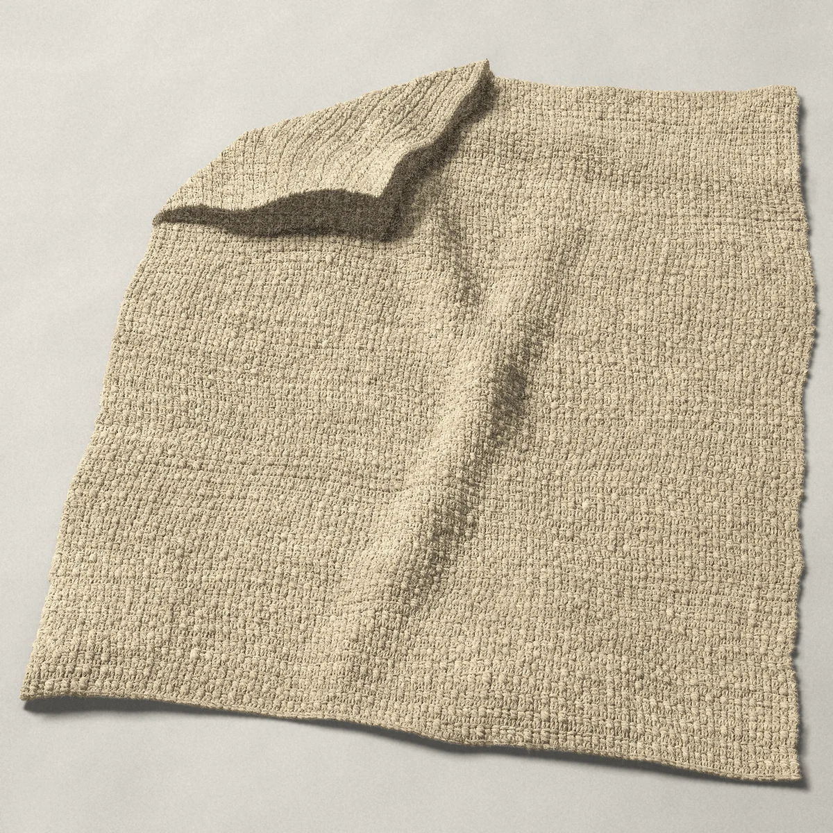 A baby blanket in aligned cobble stitch, 32¼ by 40¼ inches, spread out with a corner turned over