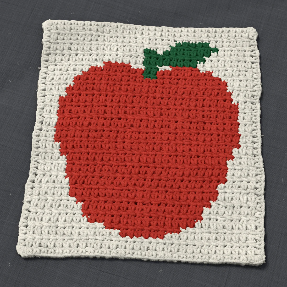 A washcloth in single crochet, 9.2 by 10.4 inches: an apple in red and dark green on a cream ground, 30 stitches by 39 rows