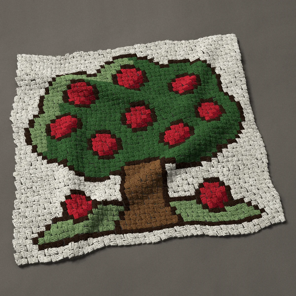 A baby blanket worked corner to corner, 36¾ by 36 inches: Apple tree full of red apples, 49 by 48 blocks