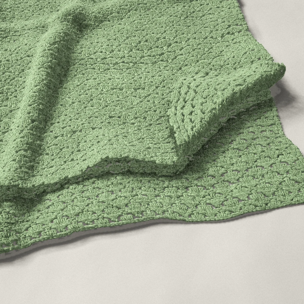 A throw in arcade stitch, 50¼ by 60 inches, folded in half with a corner turned back