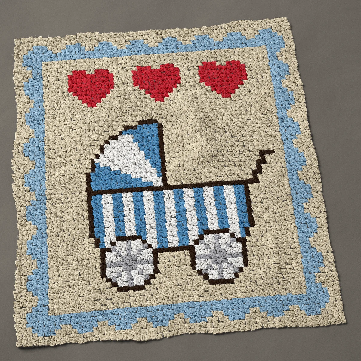 A panel worked corner to corner, 45 by 50 inches: Baby carriage sampler: a striped pram and three hearts, 60 by 67 blocks