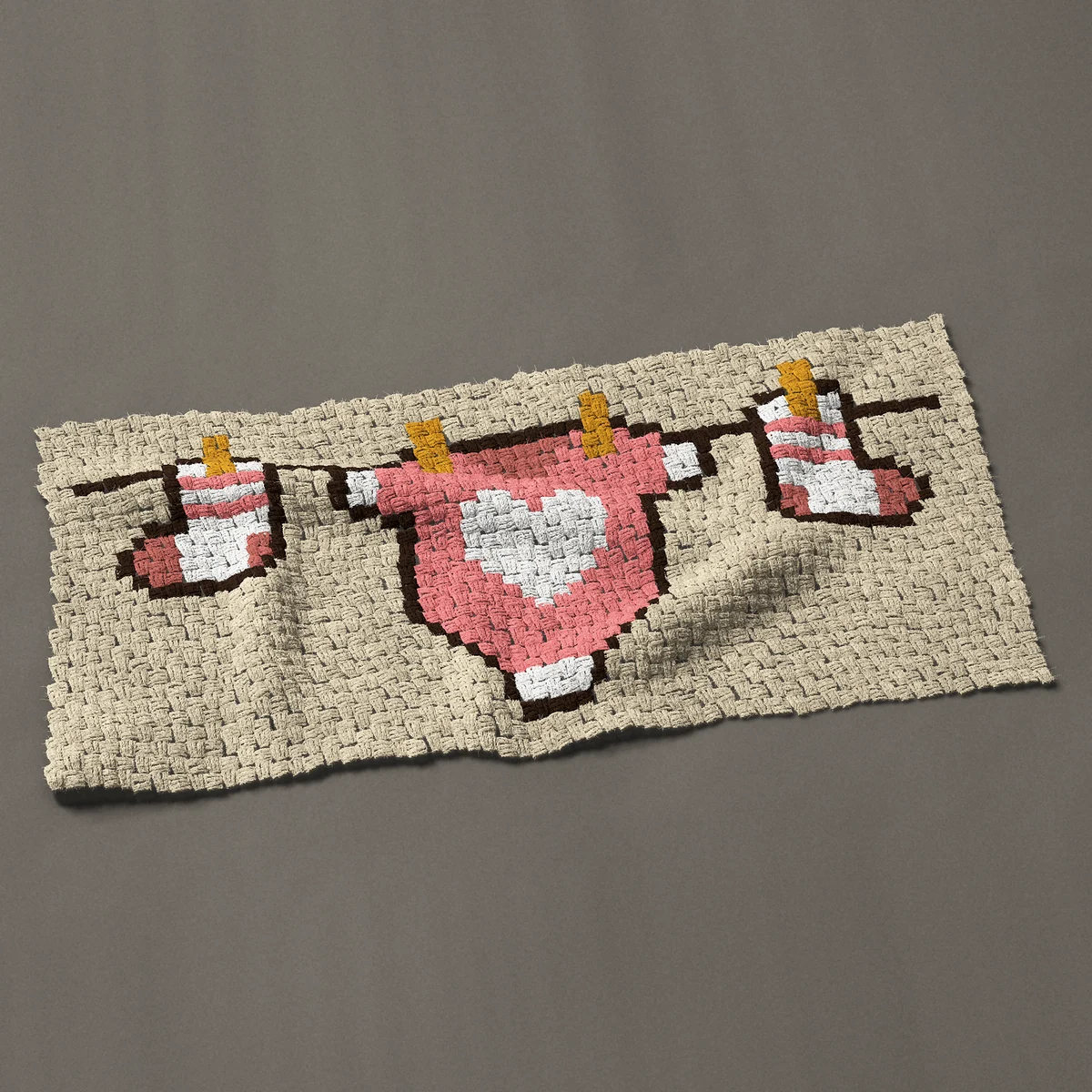 A panel worked corner to corner, 47 by 21¾ inches: Baby clothes on a clothesline, 63 by 29 blocks