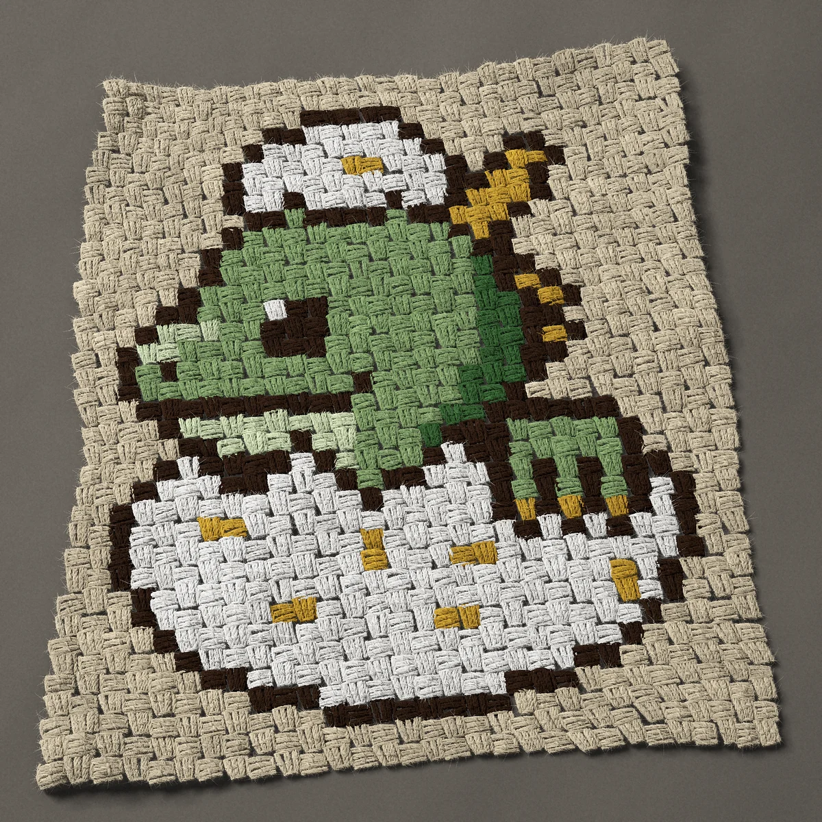 A panel worked corner to corner, 22½ by 27 inches: Baby dragon hatching from an egg, 30 by 36 blocks