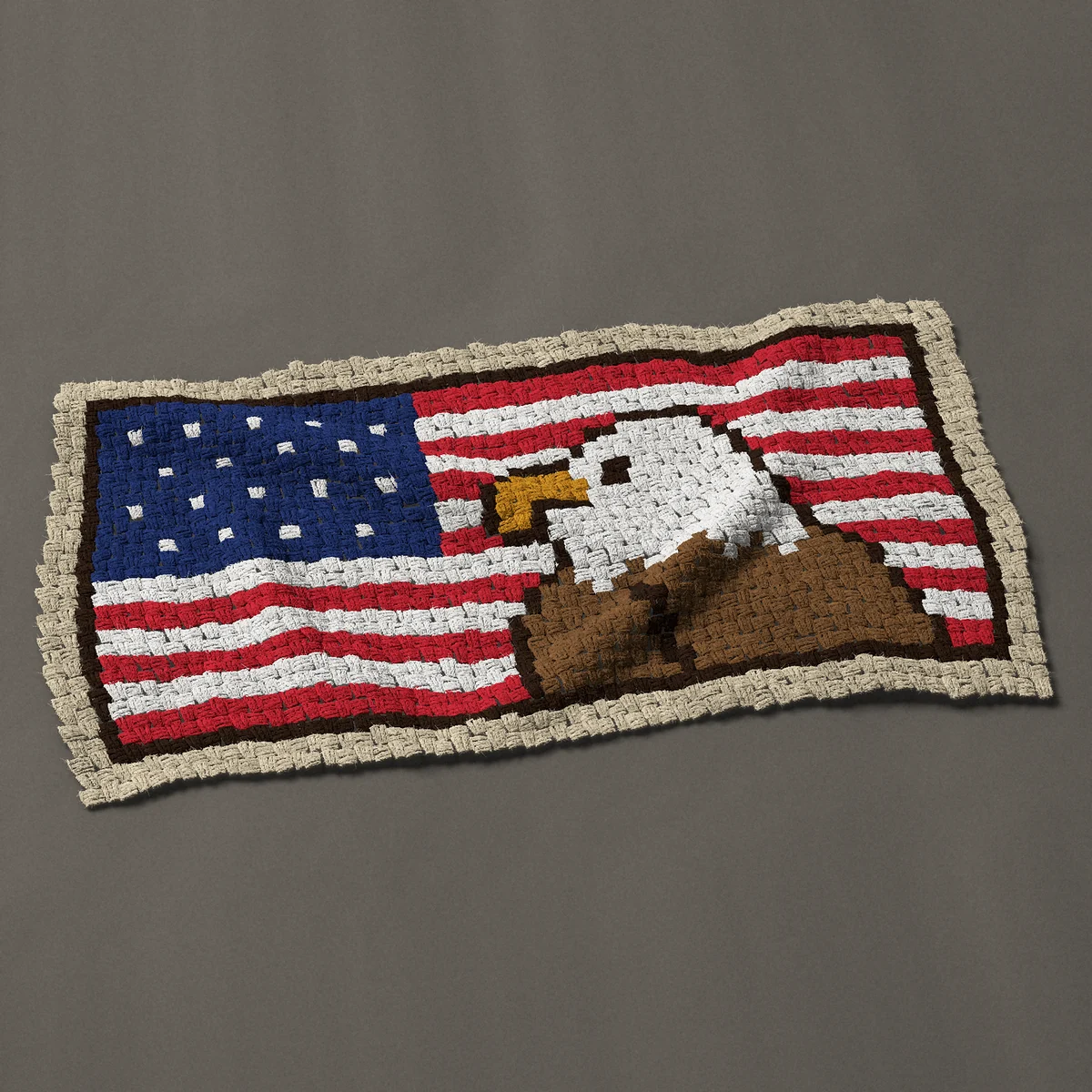 A panel worked corner to corner, 45 by 24 inches: American flag and bald eagle, head and shoulders, 60 by 32 blocks