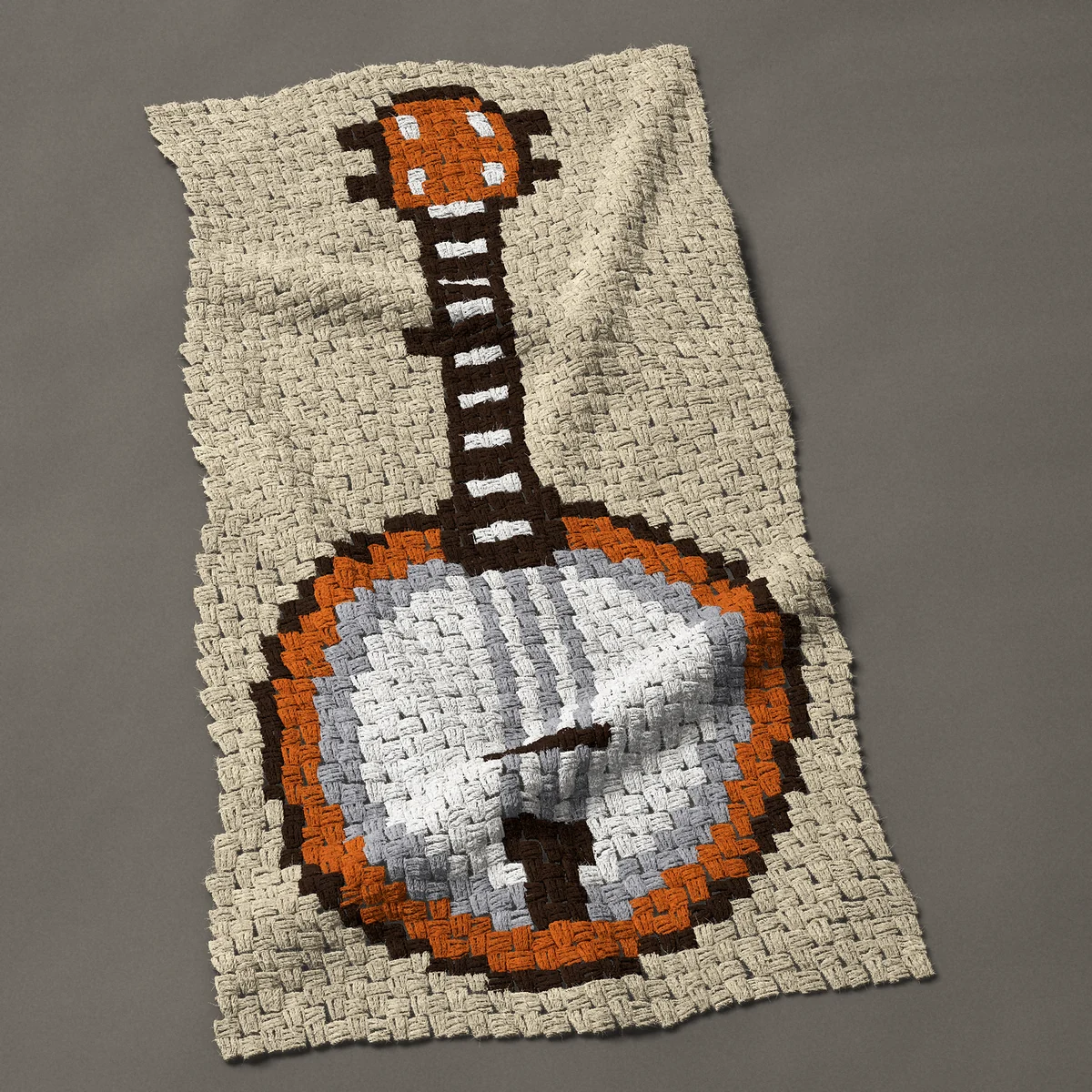 A baby blanket worked corner to corner, 24¾ by 48 inches: Banjo standing upright with a round white head, 33 by 64 blocks