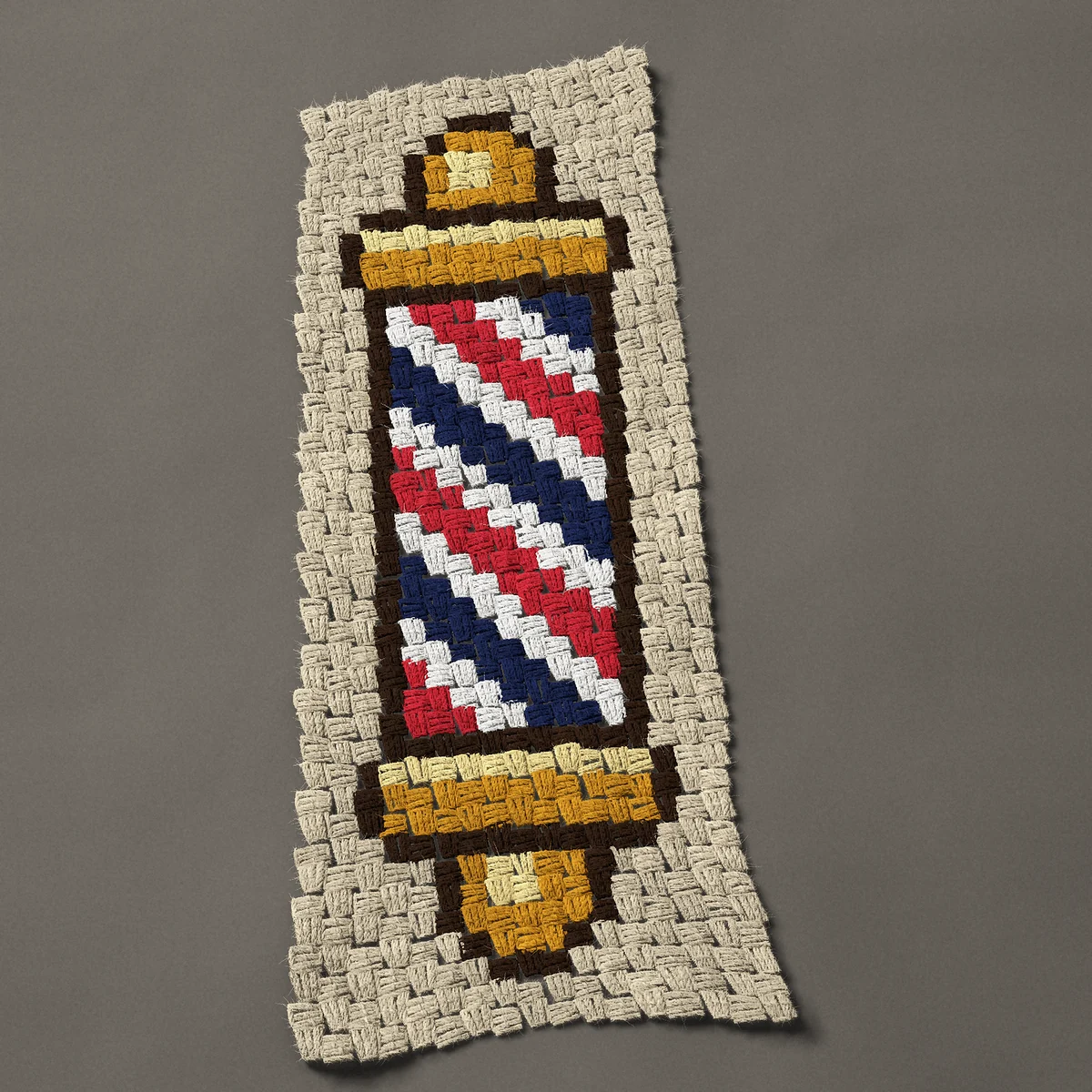 A panel worked corner to corner, 12¾ by 33 inches: Barber pole with red, white and blue stripes, 17 by 44 blocks