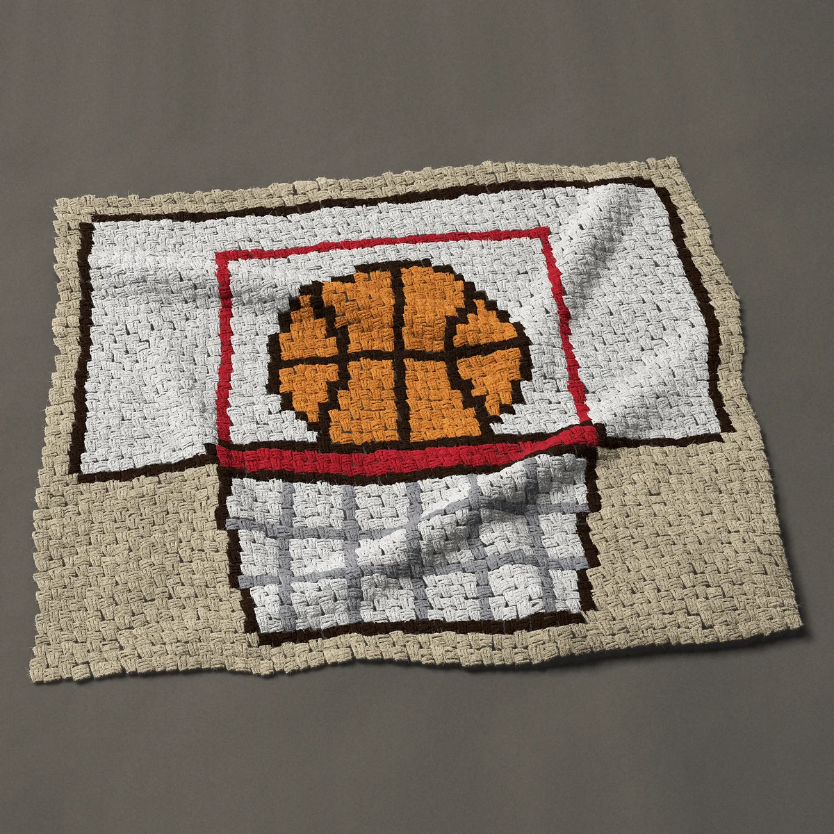 A baby blanket worked corner to corner, 44 by 38 inches: Basketball hoop with ball on the rim, backboard and net, 59 by 51 blocks