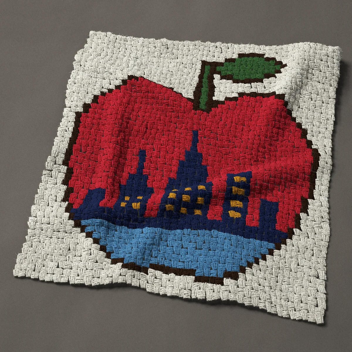 A baby blanket worked corner to corner, 33¾ by 37½ inches: Big Apple with the New York City skyline inside, 45 by 50 blocks