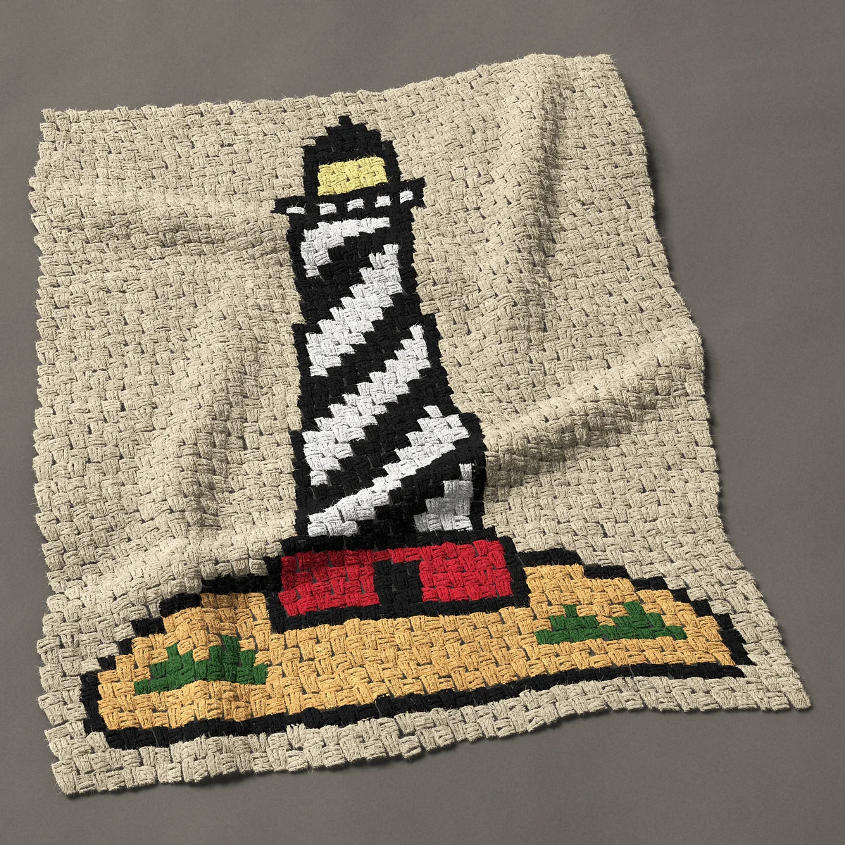 A baby blanket worked corner to corner, 33¾ by 42½ inches: Black and white spiral striped lighthouse on a dune, 45 by 57 blocks