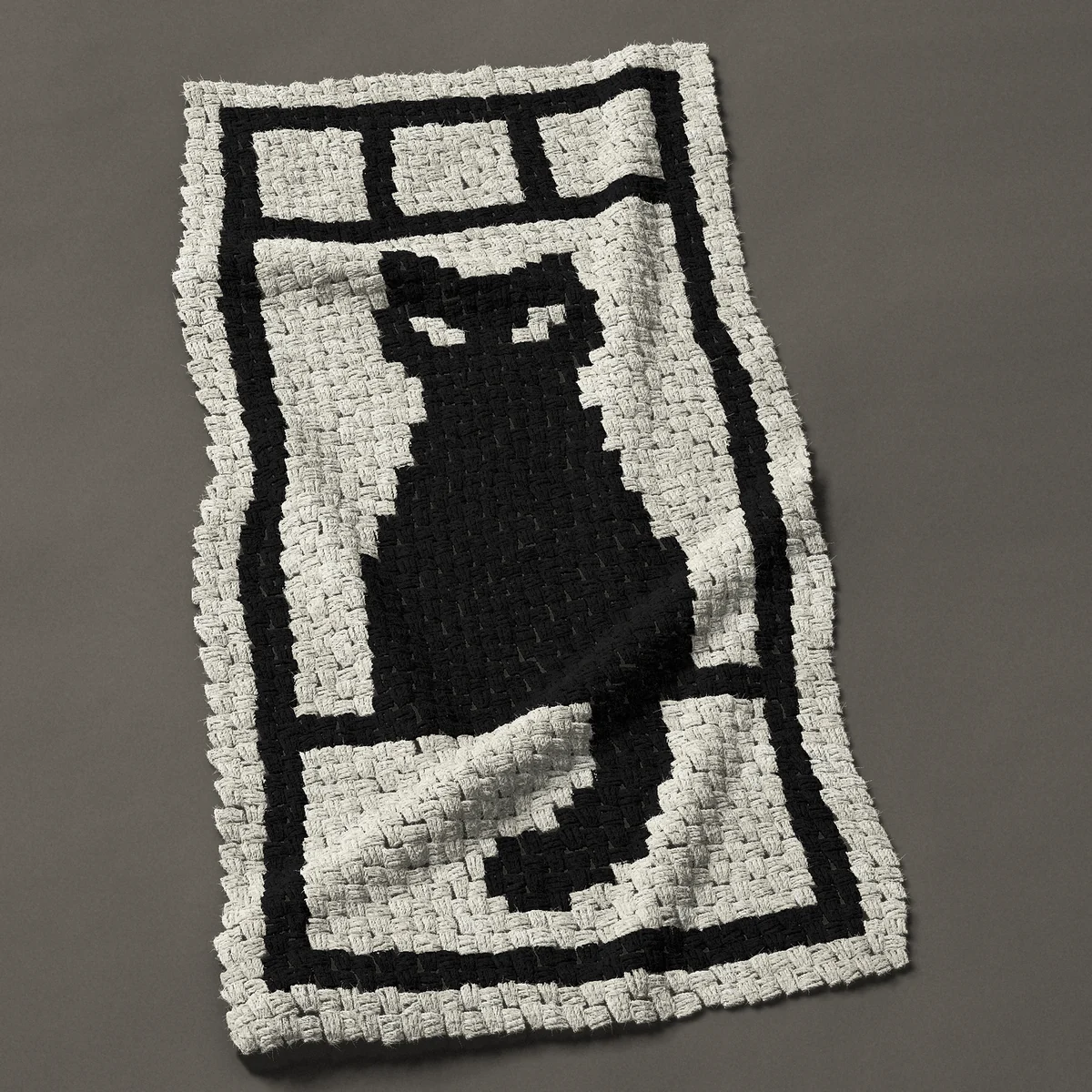 A baby blanket worked corner to corner, 24¾ by 49½ inches: Black cat silhouette sitting on a windowsill, 33 by 66 blocks