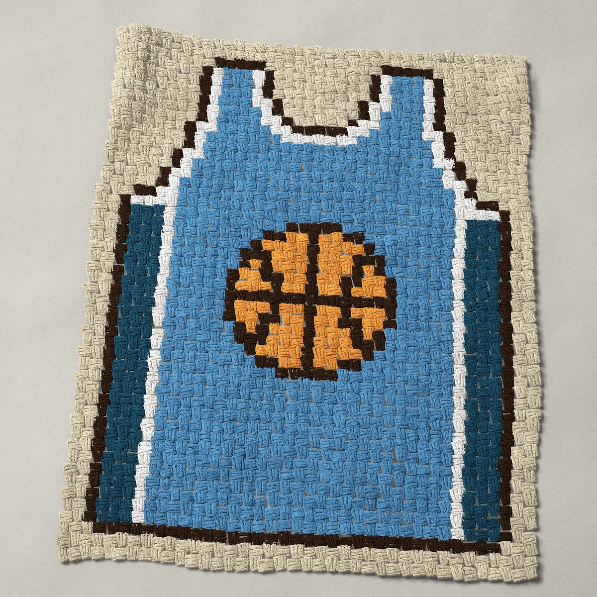 A baby blanket worked corner to corner, 29¼ by 37½ inches: Blue basketball jersey with a basketball on the chest, 39 by 50 blocks