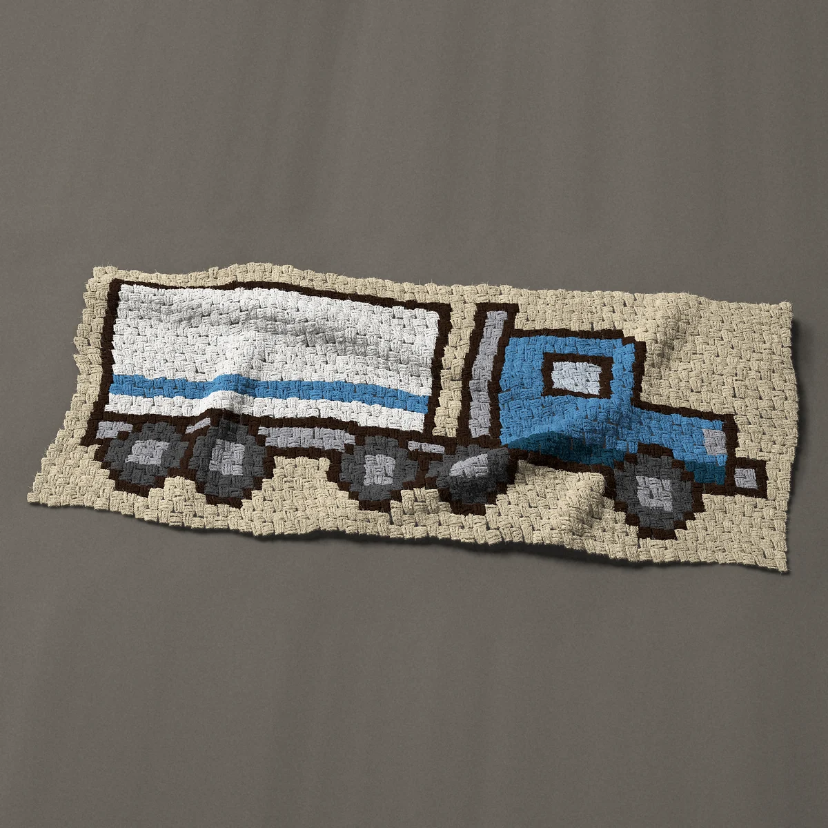 A panel worked corner to corner, 51 by 21¾ inches: Blue semi truck pulling a white box trailer, a big rig, 68 by 29 blocks