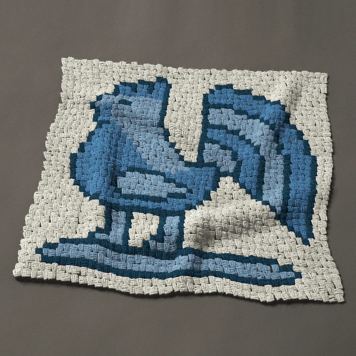 A panel worked corner to corner, 33¾ by 31½ inches: Blue toile-style rooster in three shades of blue, 45 by 42 blocks