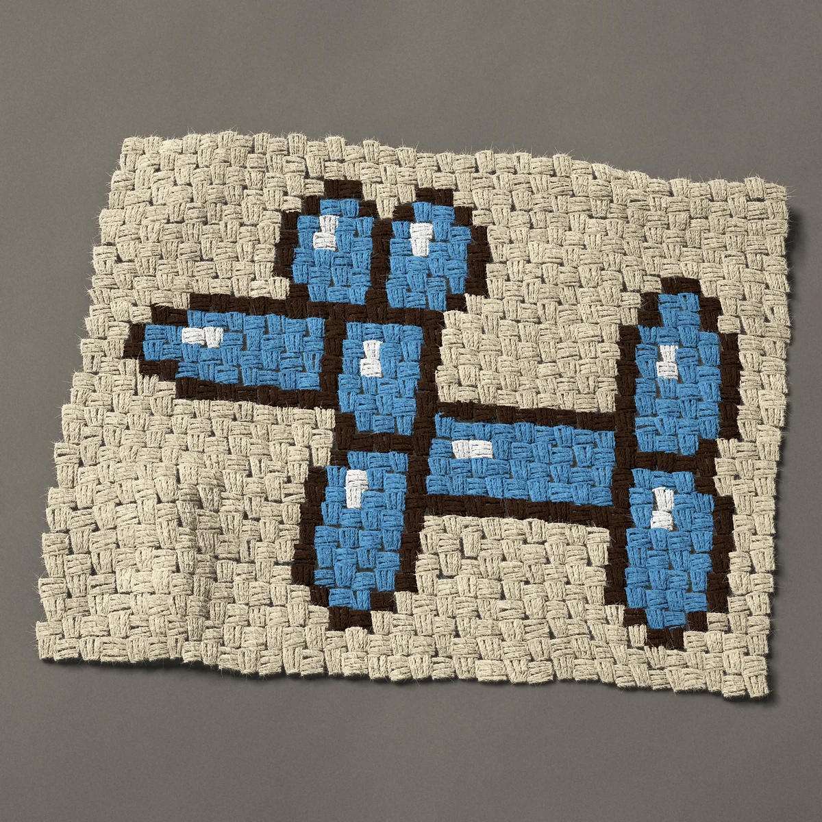 A panel worked corner to corner, 26¼ by 21 inches: Blue balloon dog, a twisted party balloon animal, 35 by 28 blocks