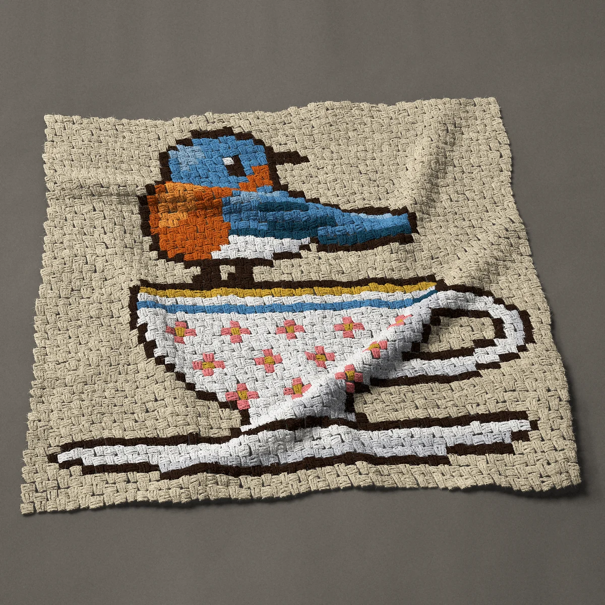A baby blanket worked corner to corner, 40½ by 38 inches: Bluebird perched on a floral teacup, 54 by 51 blocks
