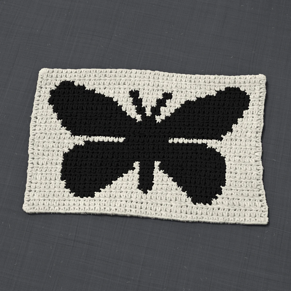 A panel in single crochet, 13.8 by 8.8 inches: a butterfly in black on a cream ground, 45 stitches by 33 rows