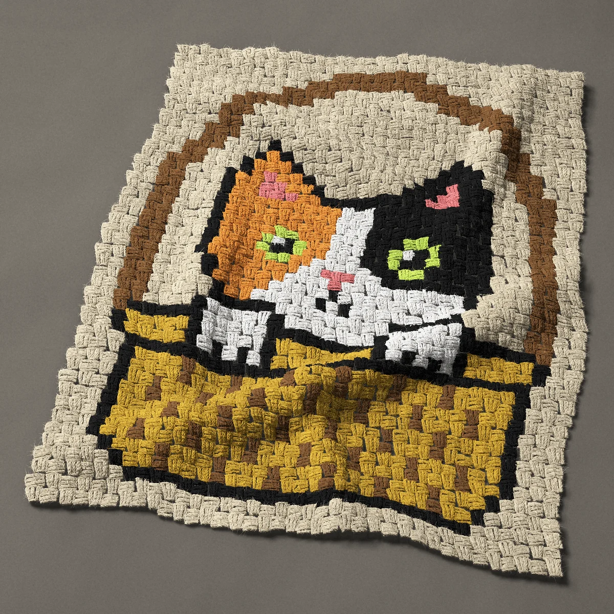A panel worked corner to corner, 27¾ by 35¼ inches: Calico kitten in a wicker basket, a calico cat, 37 by 47 blocks