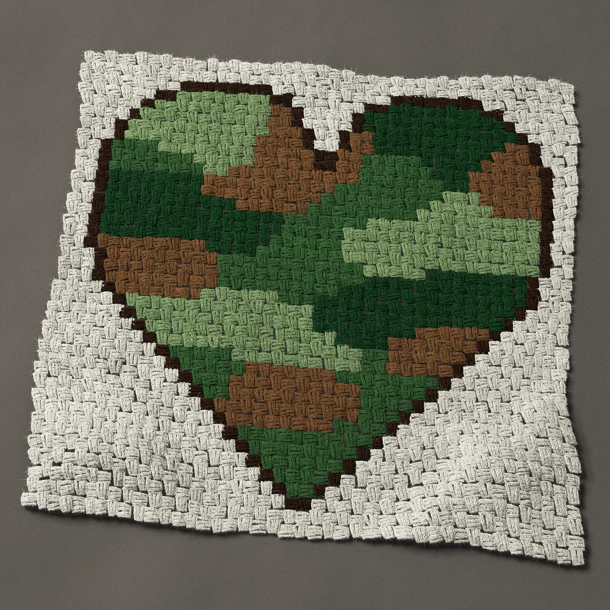 A panel worked corner to corner, 31½ by 30 inches: Camo heart: a camouflage heart in green and brown, 42 by 40 blocks