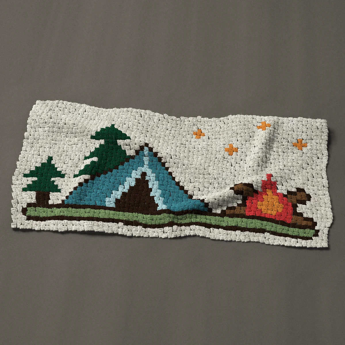 A baby blanket worked corner to corner, 51 by 25½ inches: Camping tent with a campfire and pine trees, 68 by 34 blocks