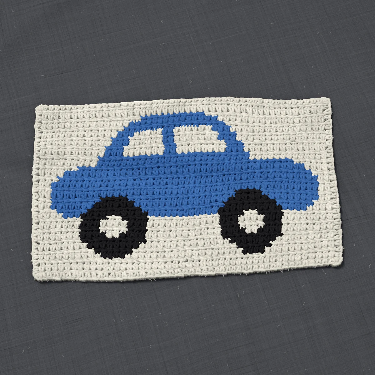 A panel in single crochet, 14.5 by 8.5 inches: a car in blue and black on a cream ground, 47 stitches by 32 rows