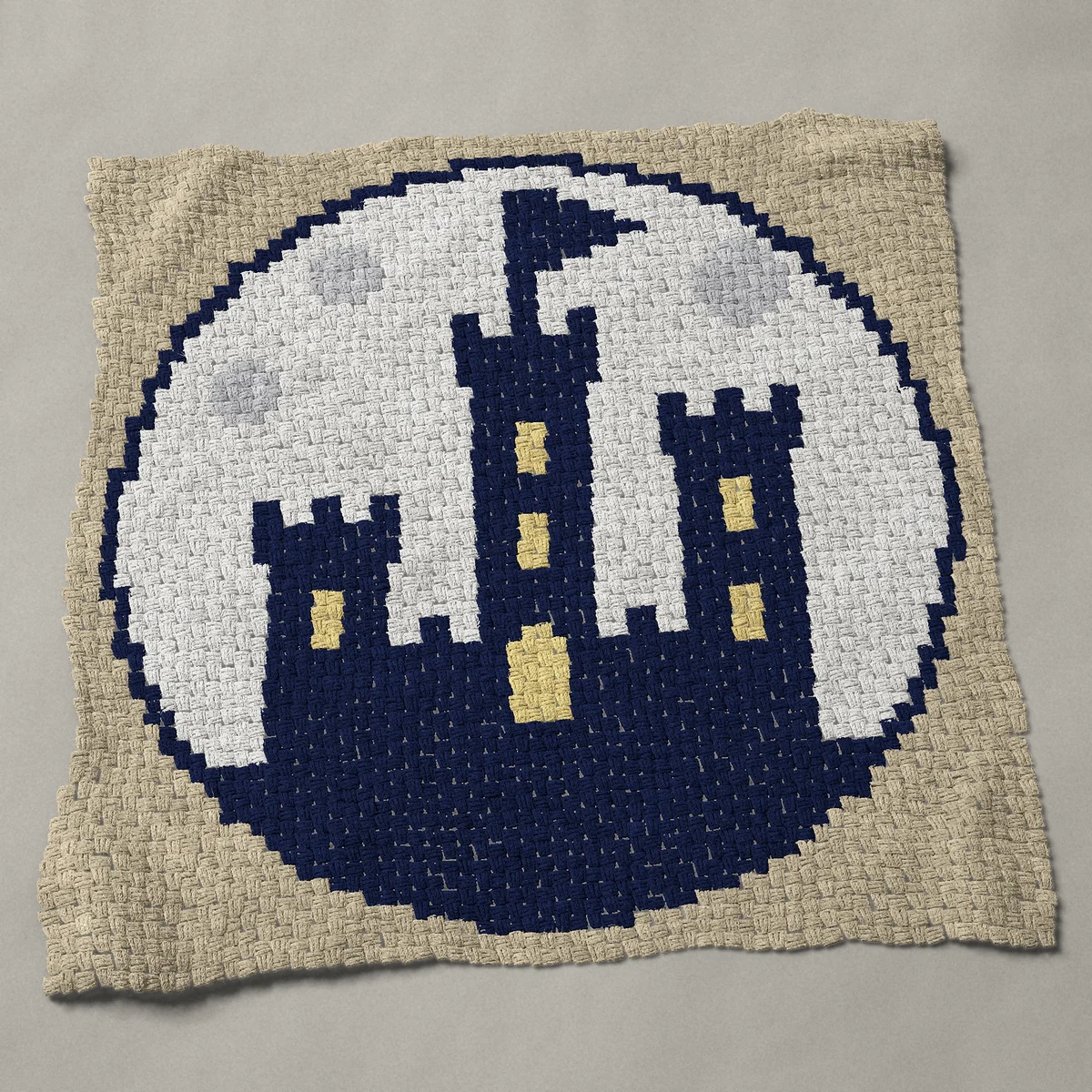 A panel worked corner to corner, 46½ by 46½ inches: Castle silhouette against a full moon, round, 62 by 62 blocks