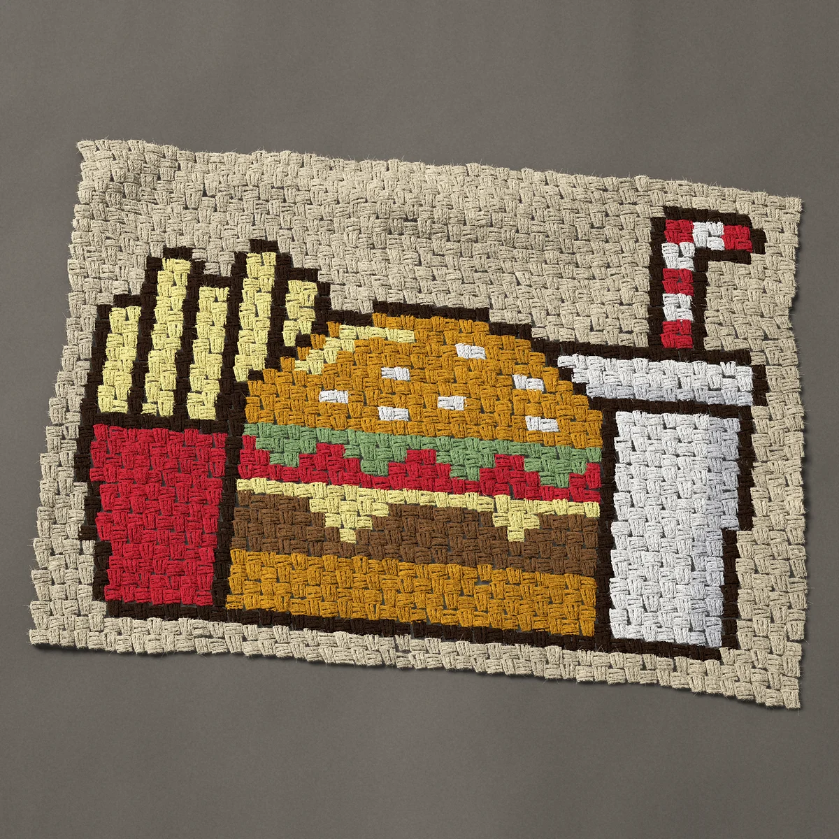 A baby blanket worked corner to corner, 37½ by 27¾ inches: Fast food cheeseburger, fries and drink, 50 by 37 blocks