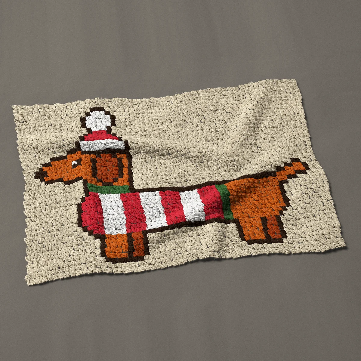 A baby blanket worked corner to corner, 45½ by 32¼ inches: Christmas dachshund in a striped sweater and Santa hat, 61 by 43 blocks