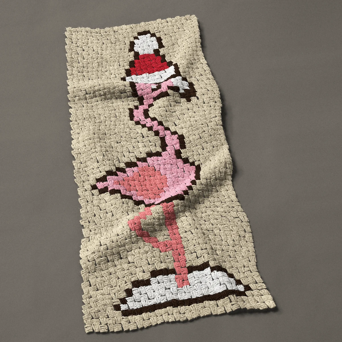 A panel worked corner to corner, 21 by 49½ inches: Christmas flamingo in a Santa hat standing in snow, 28 by 66 blocks