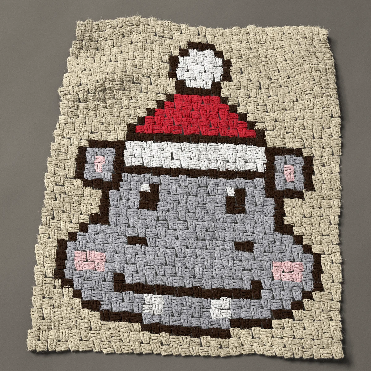 A panel worked corner to corner, 23¼ by 28½ inches: Christmas hippo in a Santa hat, 31 by 38 blocks