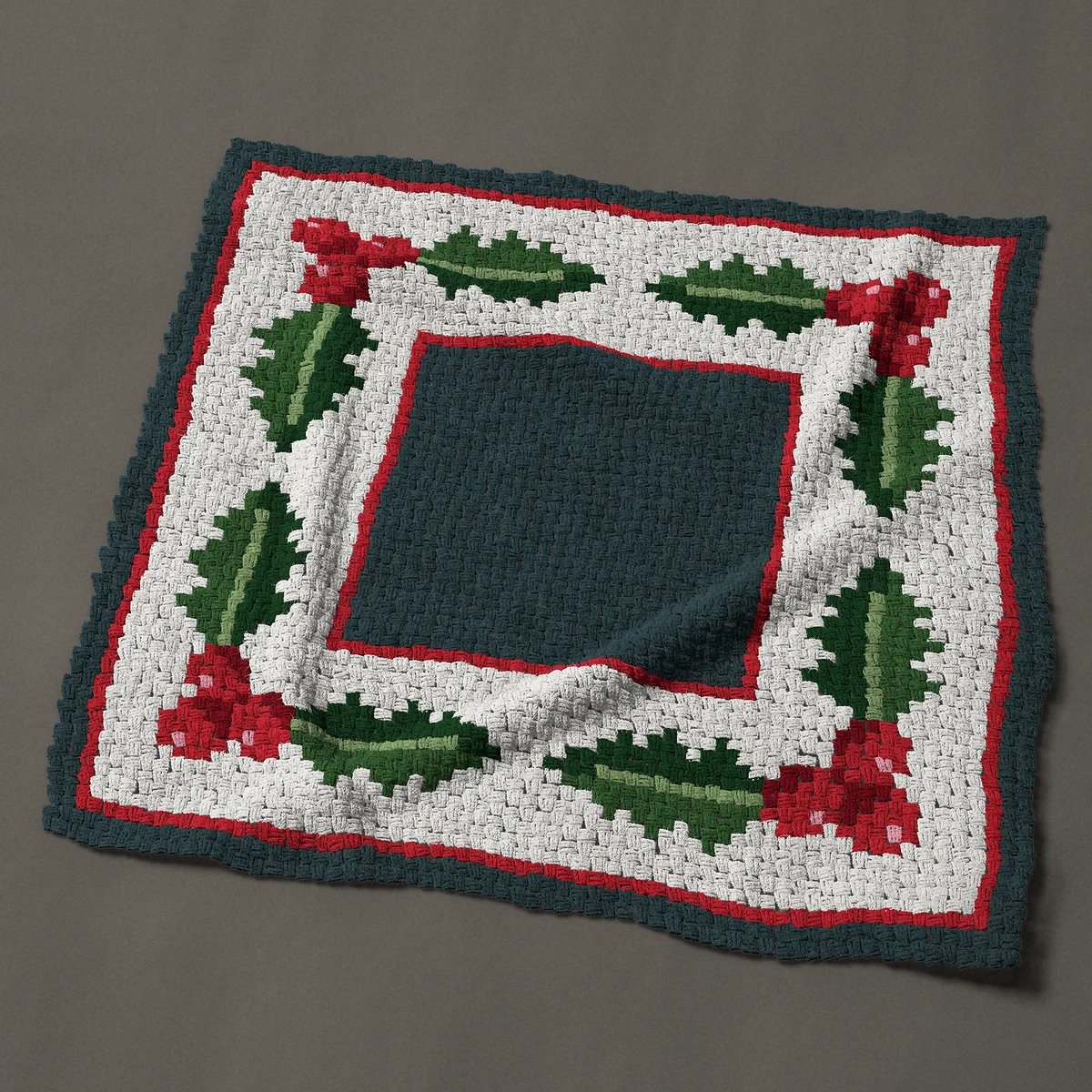 A throw worked corner to corner, 50 by 50 inches: Christmas holly border frame with red berries, 67 by 67 blocks