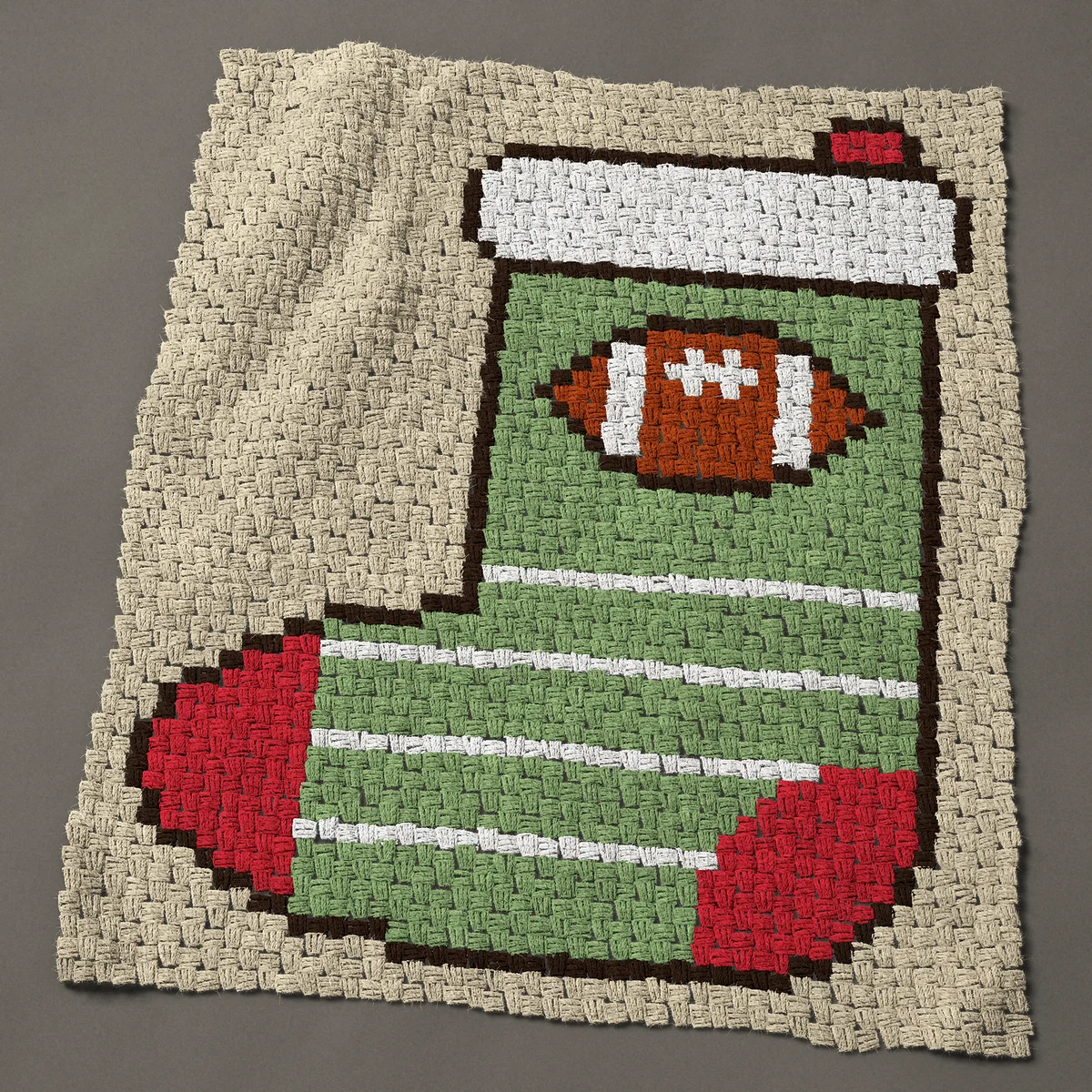 A baby blanket worked corner to corner, 35¼ by 42 inches: Football Christmas stocking in green with yard lines, 47 by 56 blocks