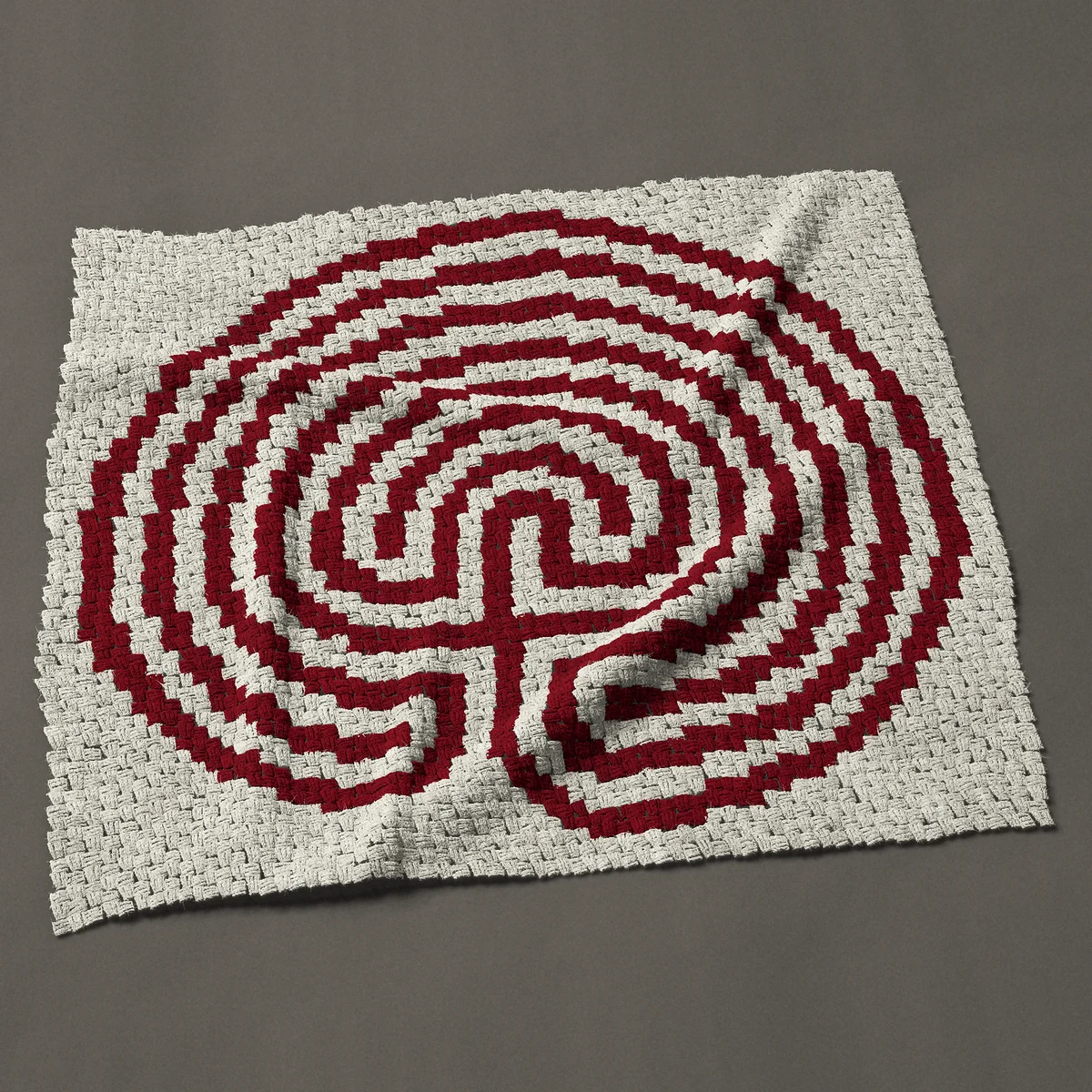 A panel worked corner to corner, 49½ by 45 inches: Classical seven-circuit labyrinth in one color, 66 by 60 blocks