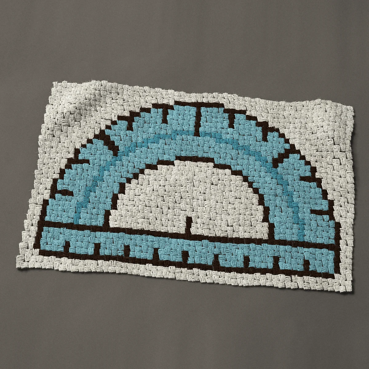 A baby blanket worked corner to corner, 41 by 26¼ inches: Math protractor in clear blue with tick marks, 55 by 35 blocks