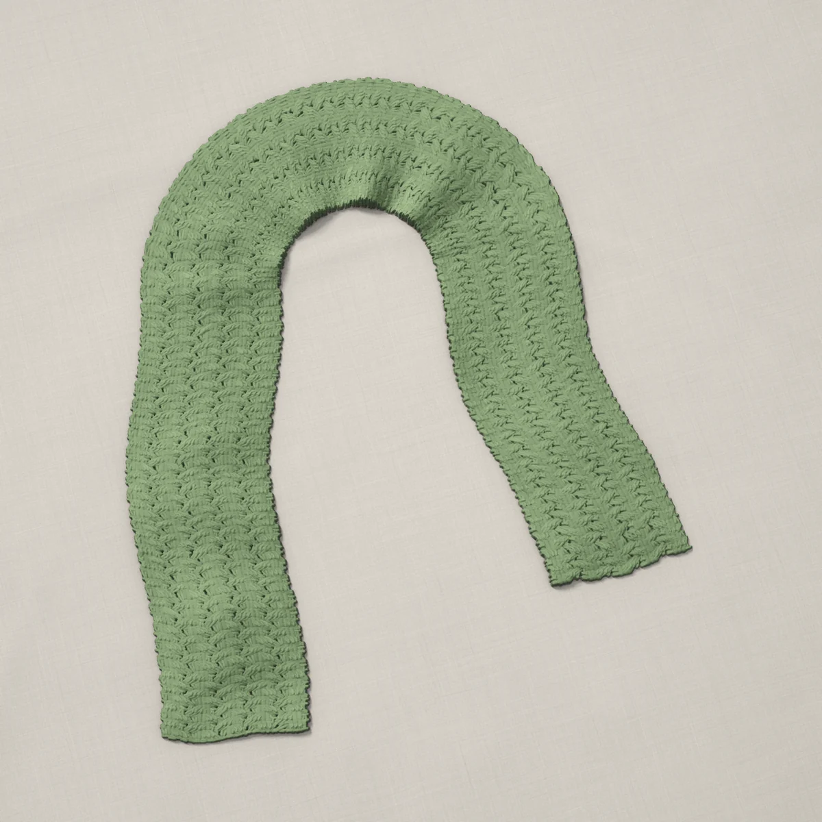 A scarf in crazy stitch, 6.8 by 60 inches, lying in a loose bend
