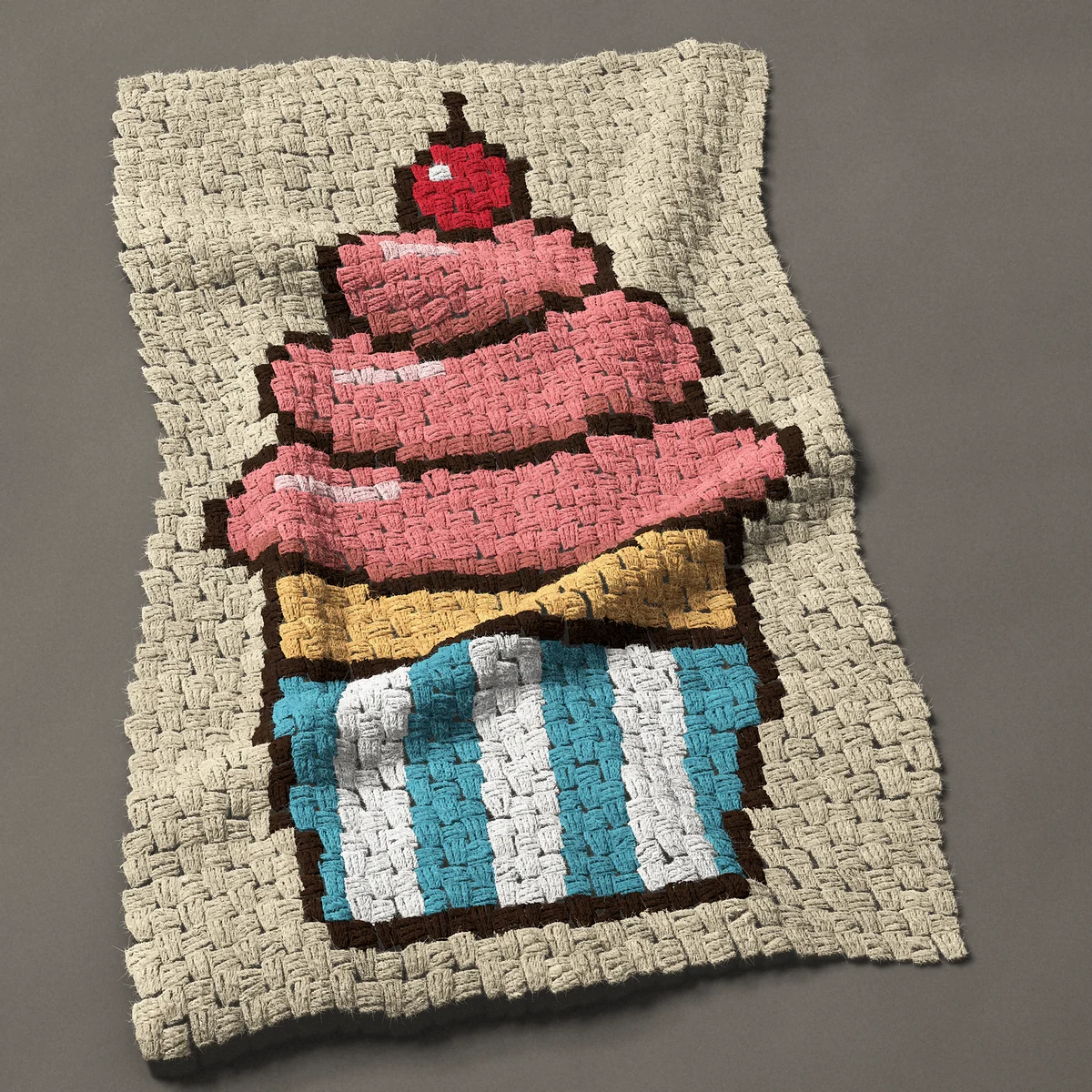 A baby blanket worked corner to corner, 24¾ by 39 inches: Cupcake with pink swirl icing and a cherry on top, 33 by 52 blocks