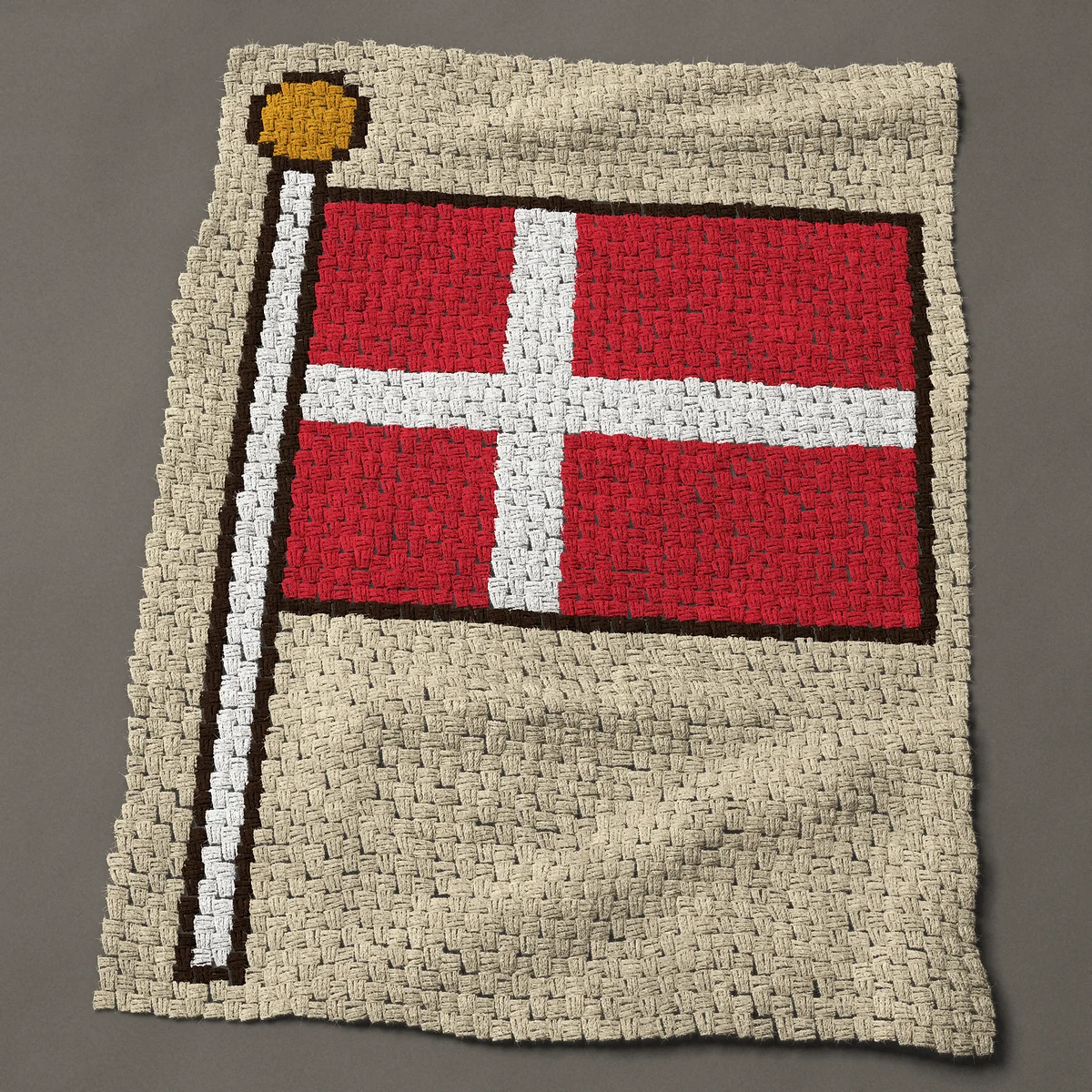 A lap blanket worked corner to corner, 36 by 48½ inches: Danish flag on a flagpole: the flag of Denmark, 48 by 65 blocks