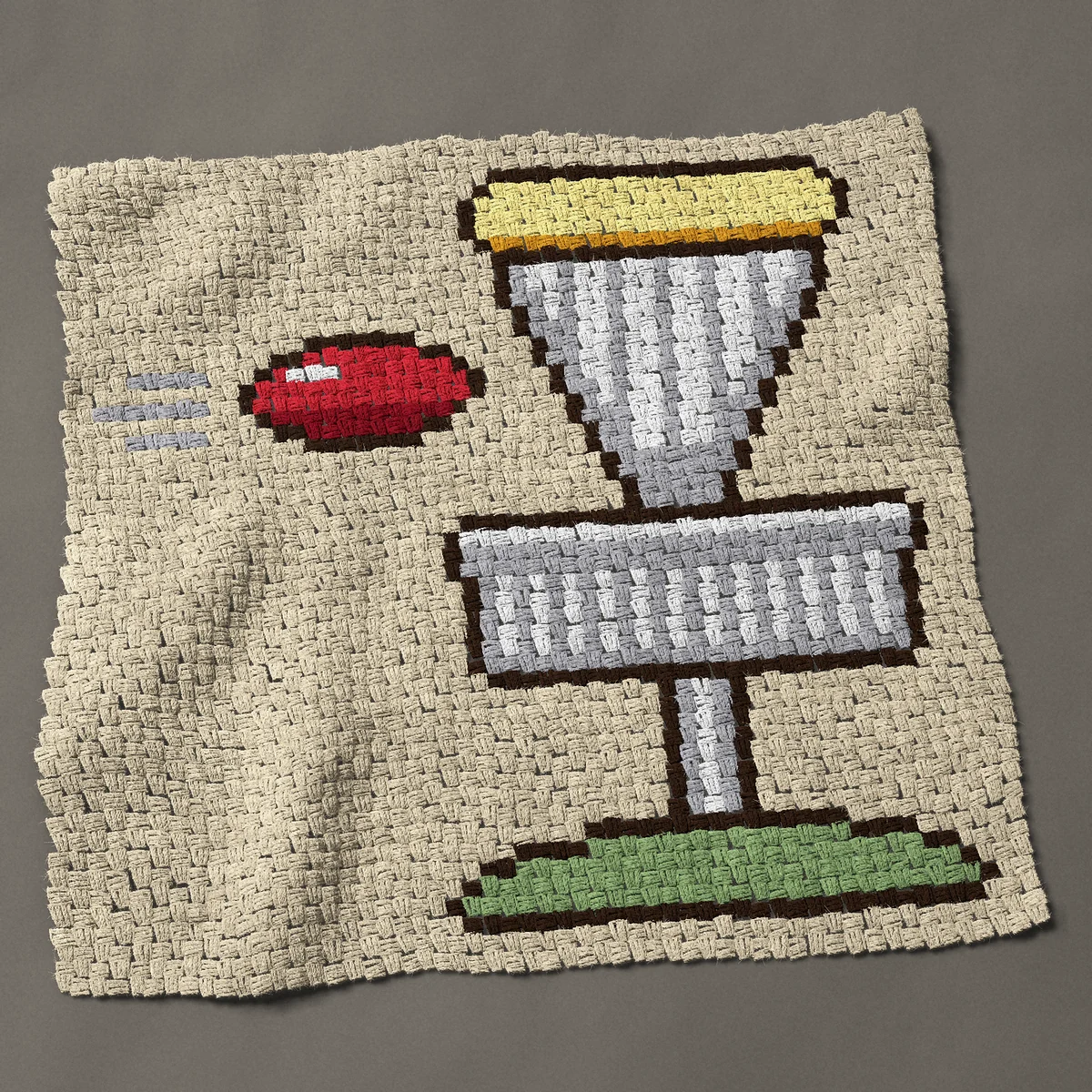 A baby blanket worked corner to corner, 41 by 39½ inches: Disc golf basket with a red disc flying in, 55 by 53 blocks