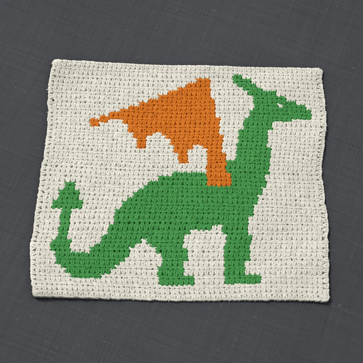 A pillow front in single crochet, 17.2 by 14.7 inches: a dragon in green and orange on a cream ground, 56 stitches by 55 rows