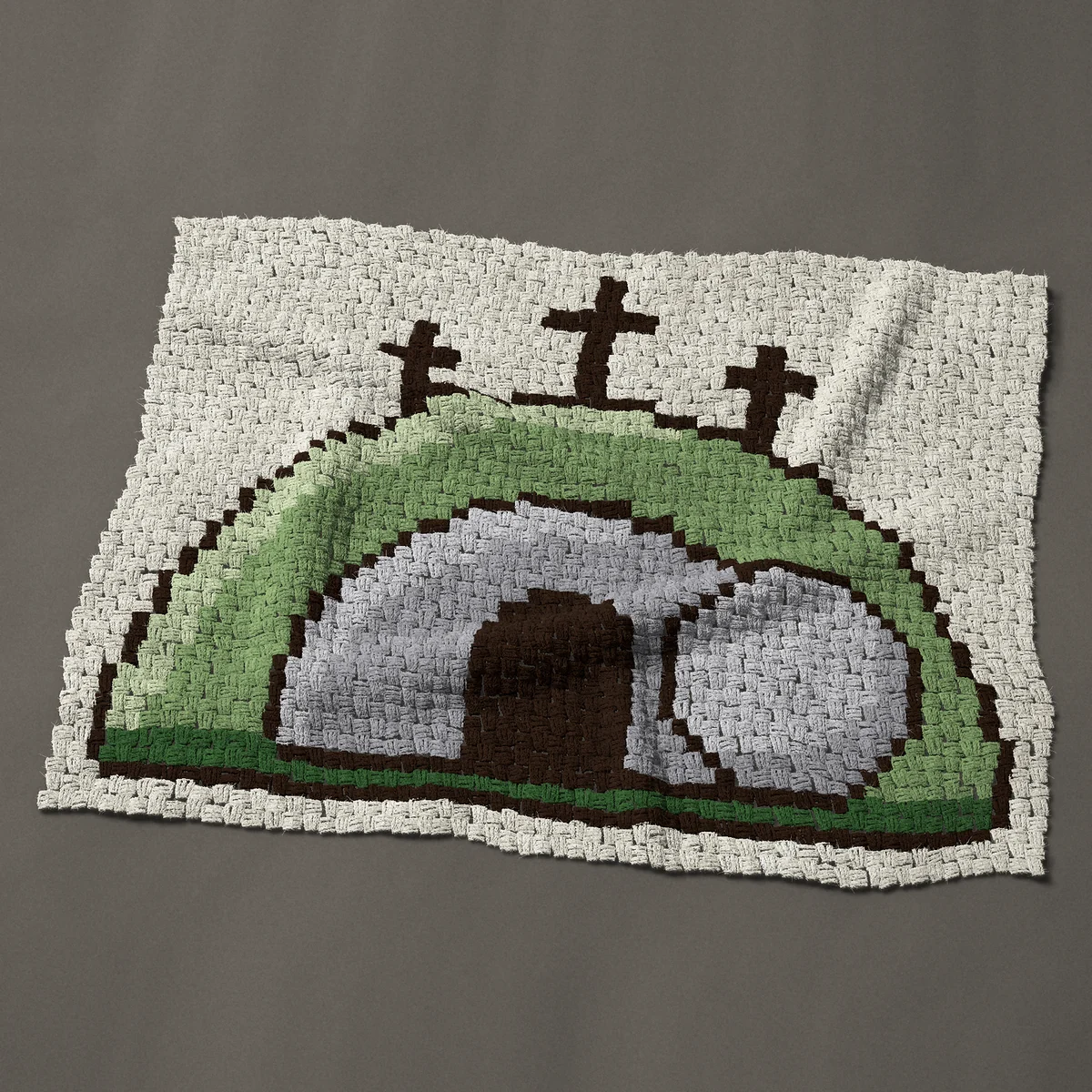 A baby blanket worked corner to corner, 45 by 35¼ inches: Religious Easter empty tomb with three crosses, 60 by 47 blocks