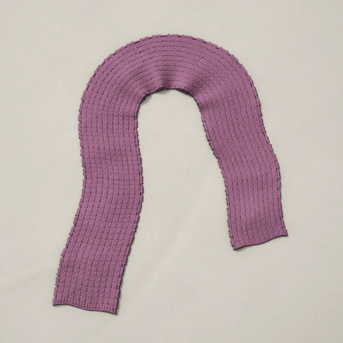 A scarf in crossed double crochet in every row, 6¾ by 60 inches, lying in a loose bend