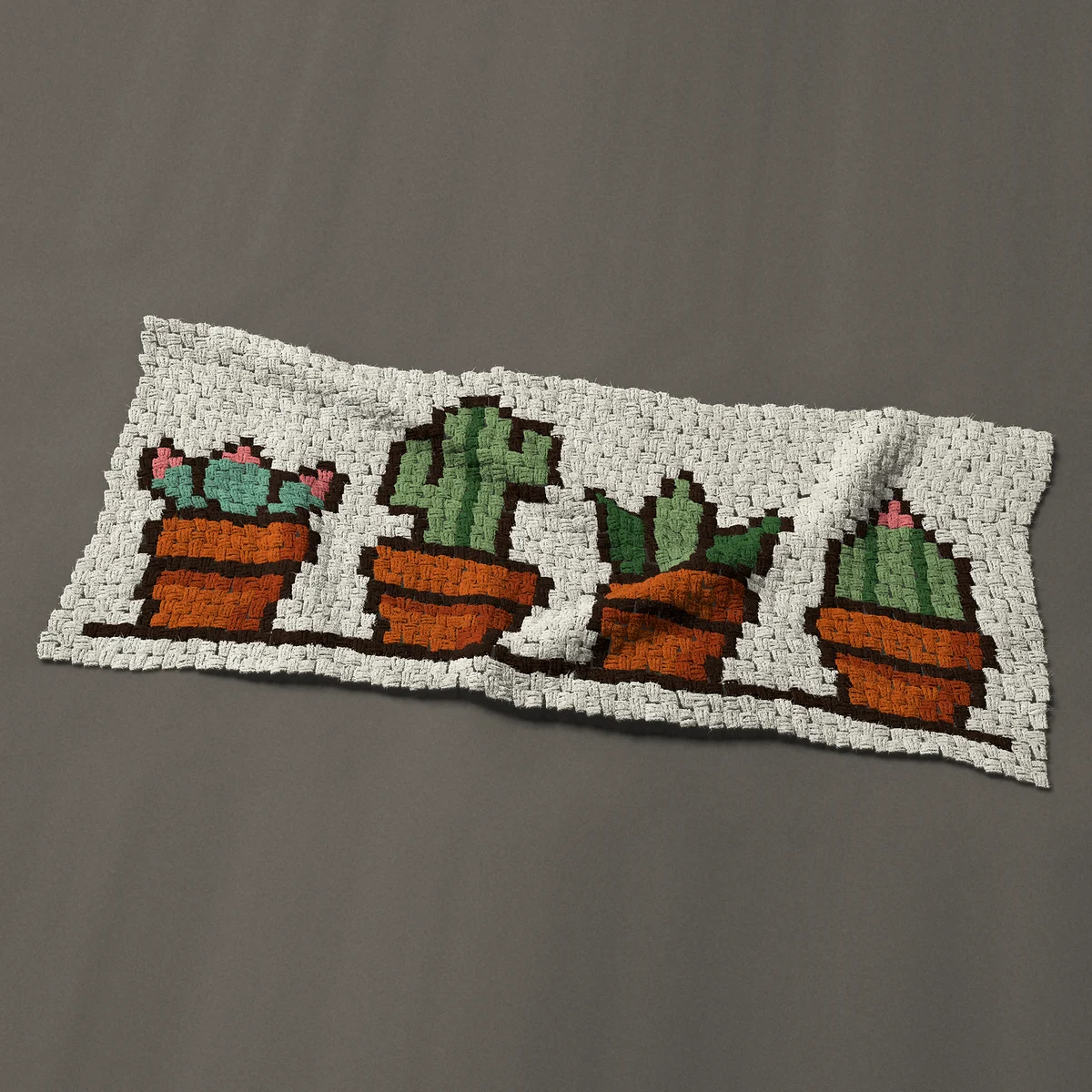A panel worked corner to corner, 50 by 21¾ inches: Four potted succulents and cacti in a row, 67 by 29 blocks