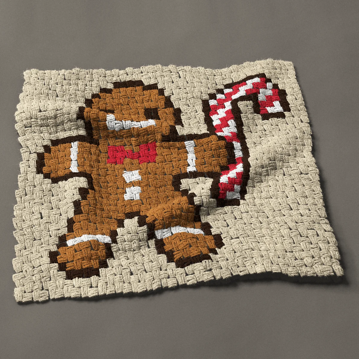 A panel worked corner to corner, 29¼ by 27 inches: Gingerbread man with a candy cane and a red bow tie, 39 by 36 blocks