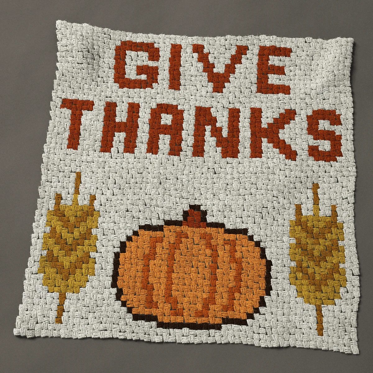 A baby blanket worked corner to corner, 40½ by 42½ inches: Give thanks Thanksgiving sign with pumpkin and wheat, 54 by 57 blocks