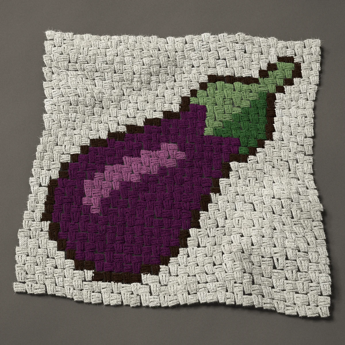 A panel worked corner to corner, 24 by 24 inches: Glossy purple eggplant on a slant, 32 by 32 blocks