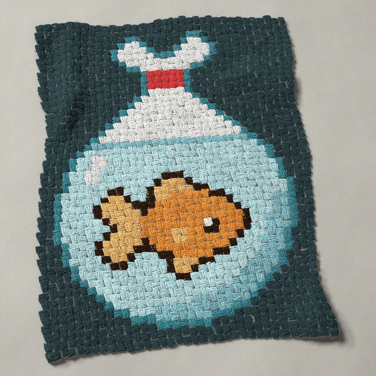 A panel worked corner to corner, 26¼ by 35¼ inches: Goldfish in a bag of water tied with a red band, 35 by 47 blocks