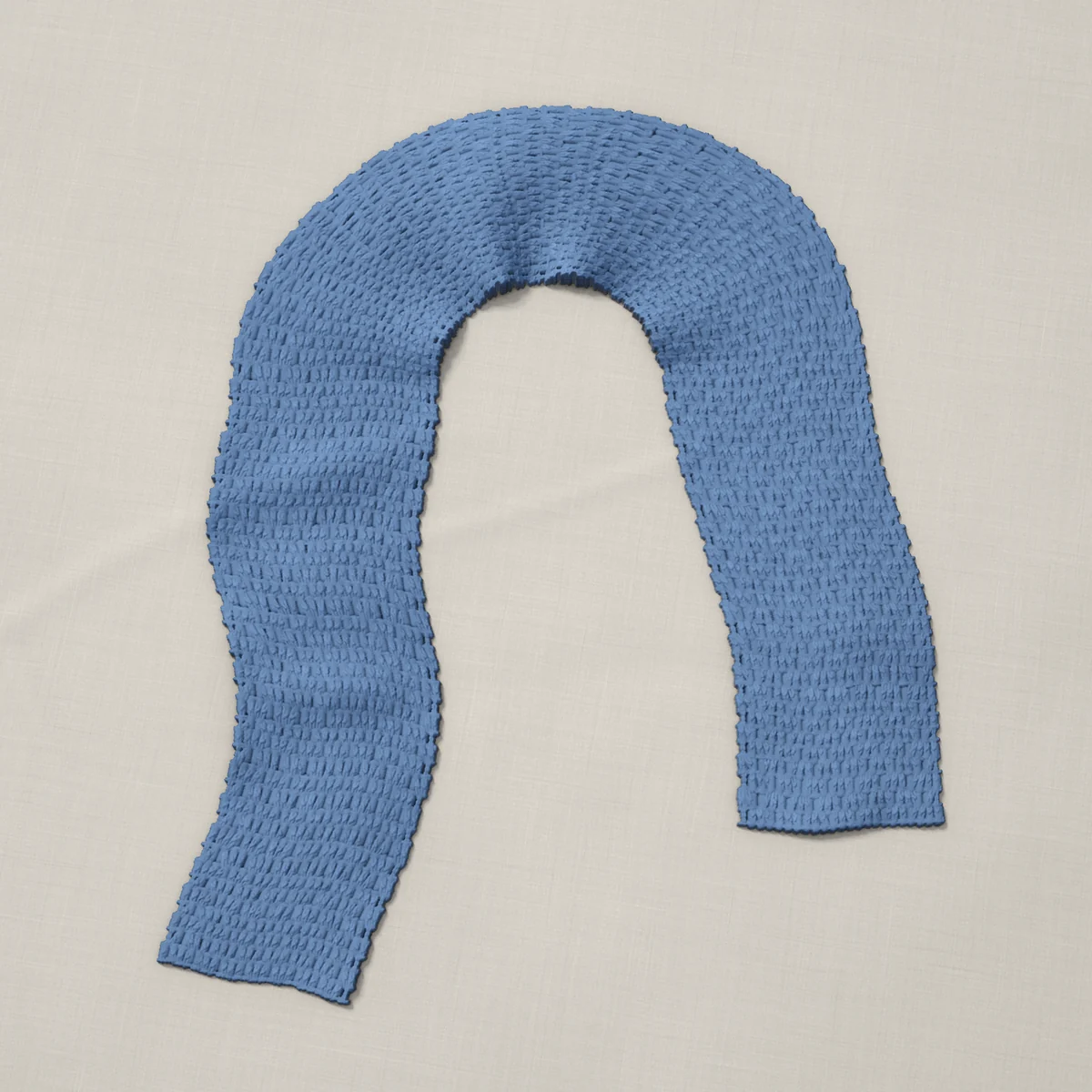 A scarf in granny stripe, 7 by 60¼ inches, lying in a loose bend