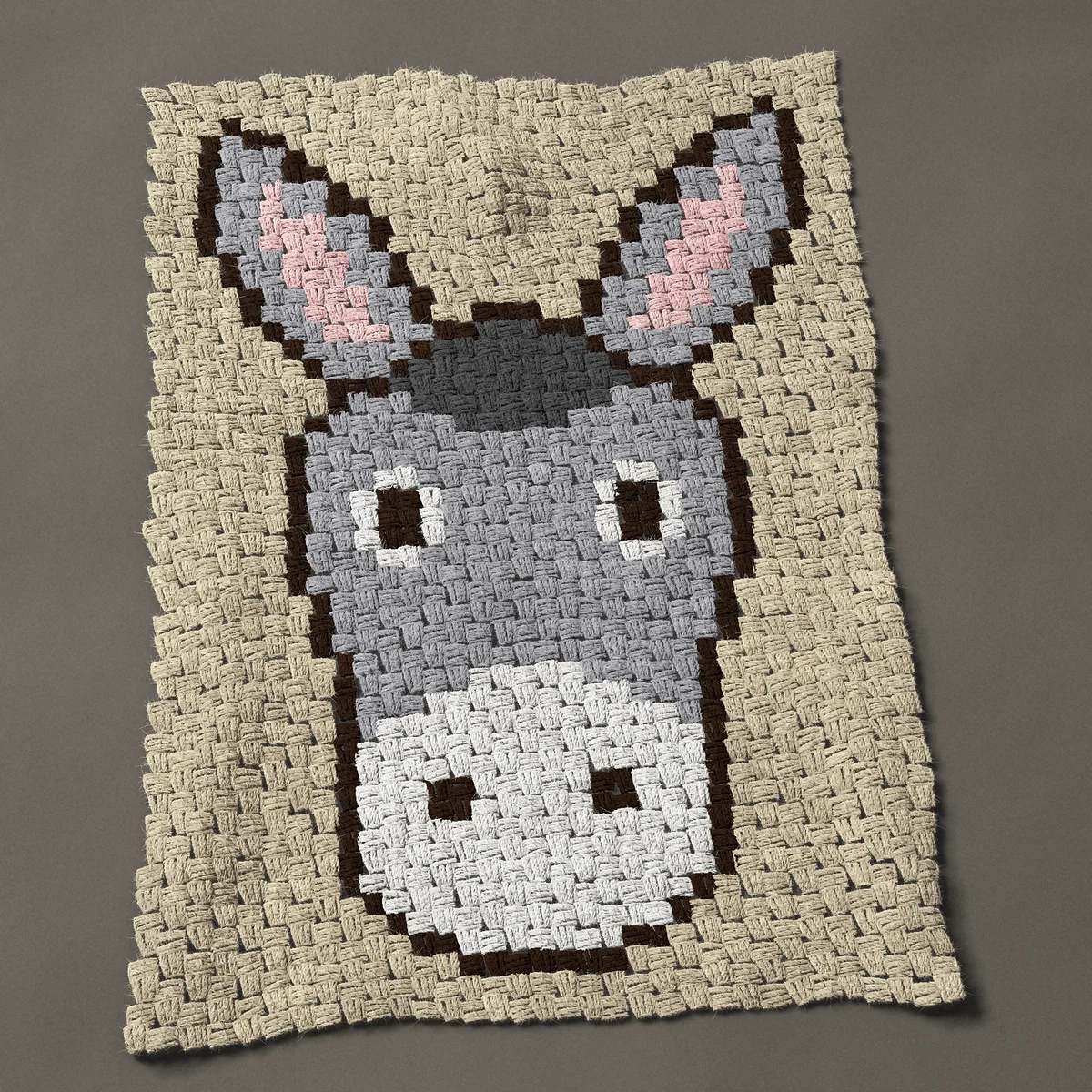 A panel worked corner to corner, 24¾ by 36 inches: Gray donkey face with long ears and a white muzzle, 33 by 48 blocks