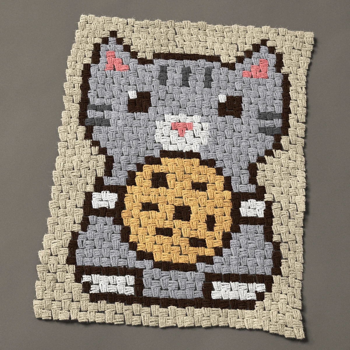 A panel worked corner to corner, 23¼ by 30 inches: Gray tabby cat holding a chocolate chip cookie, 31 by 40 blocks