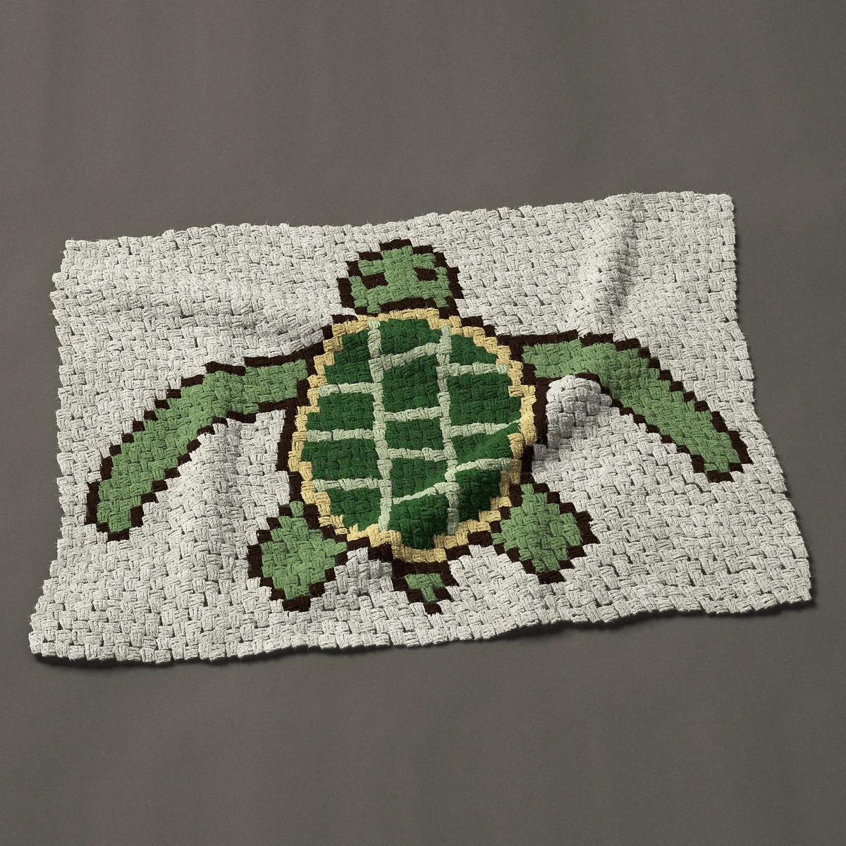 A baby blanket worked corner to corner, 44 by 31½ inches: Green sea turtle from above with swept-back flippers, 59 by 42 blocks