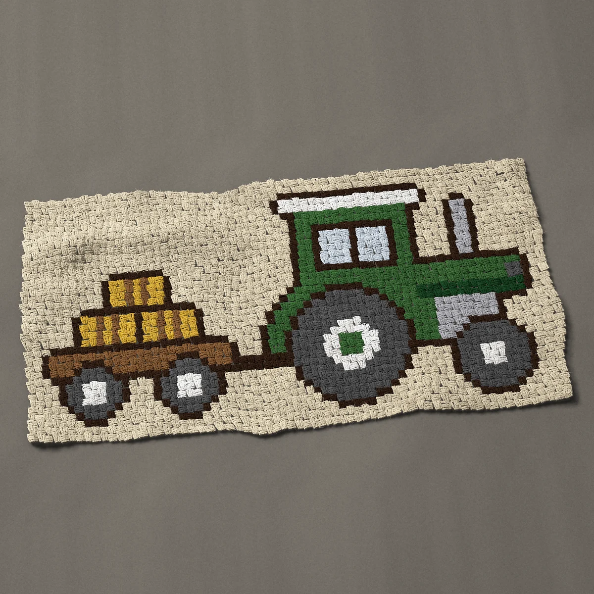 A baby blanket worked corner to corner, 51 by 26¼ inches: Green farm tractor pulling a trailer of hay bales, 68 by 35 blocks